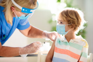 little boy getting covid vaccine